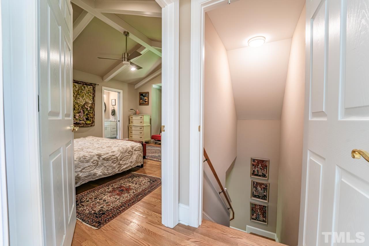 3318 Hampton Road Raleigh, NC 27607 - Photo 48 of 56 a en suite bathroom with a granite countertop sink and a mirror