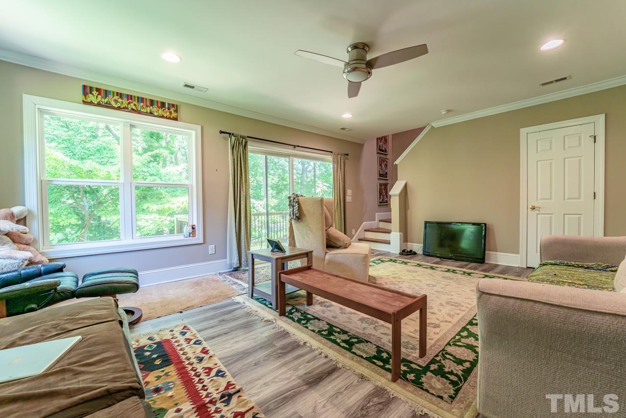 3318 Hampton Road Raleigh, NC 27607 - Photo 49 of 56 a living room with furniture and a fireplace