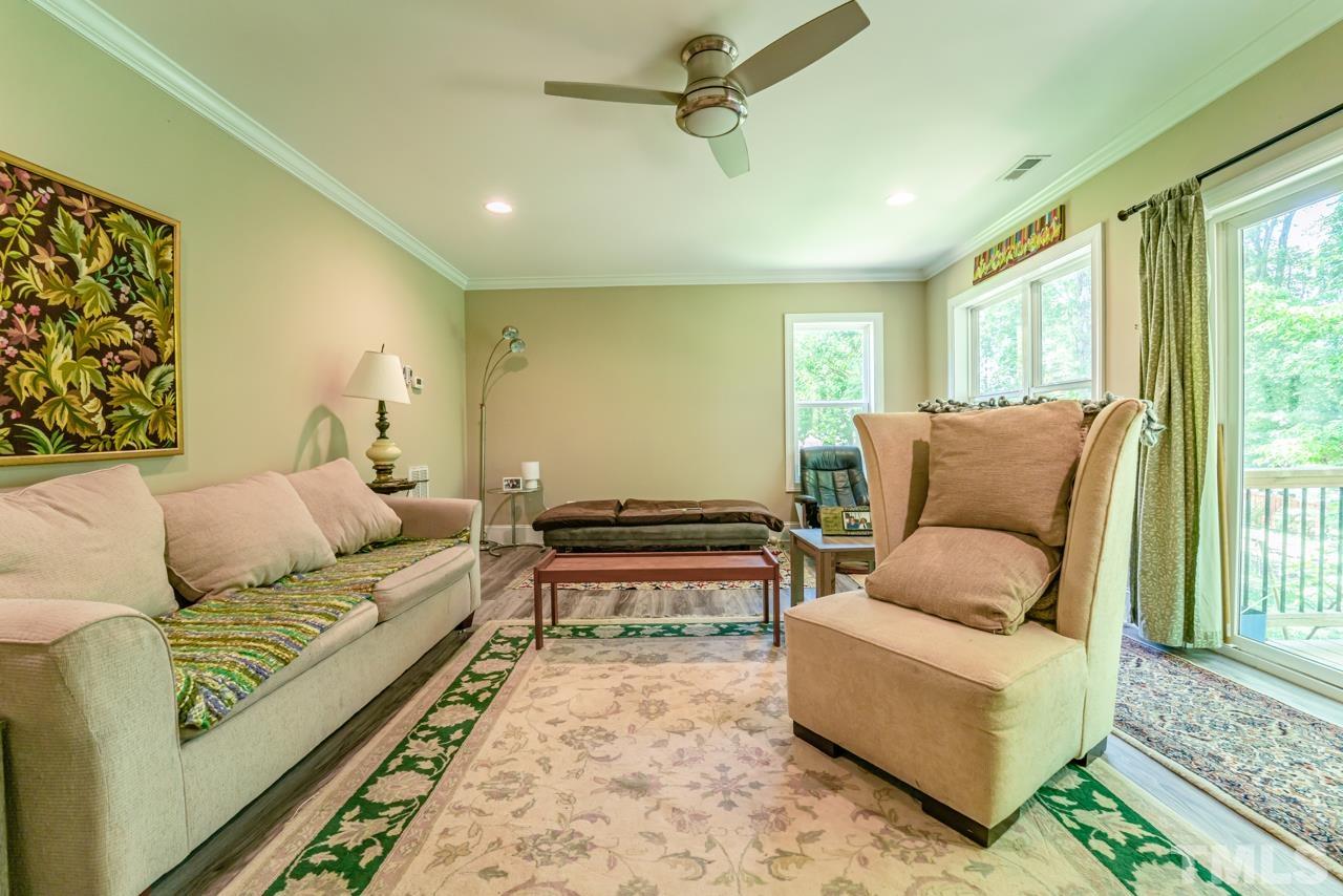 3318 Hampton Road Raleigh, NC 27607 - Photo 50 of 56 a living room with furniture and a rug