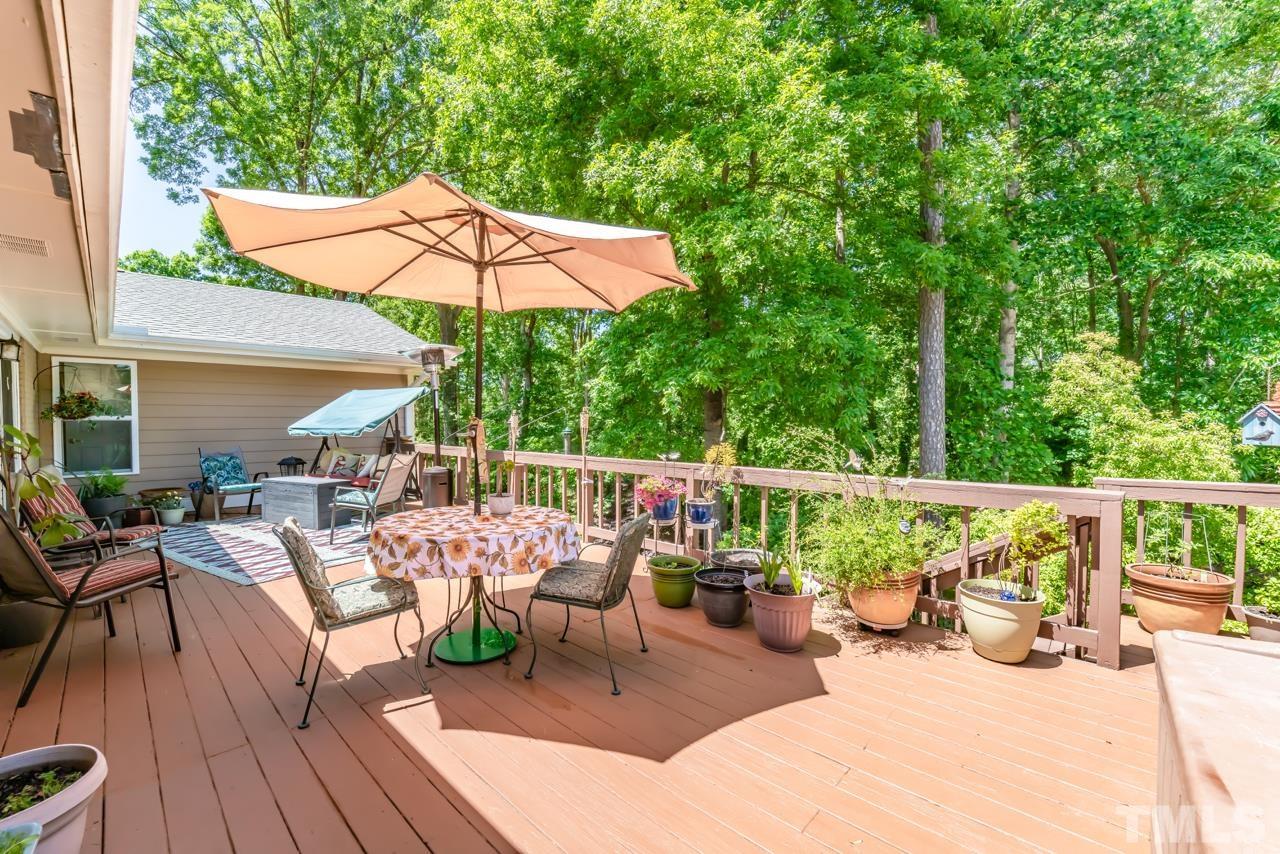 3318 Hampton Road Raleigh, NC 27607 - Photo 52 of 56 a view of balcony with outdoor seating and wooden floor