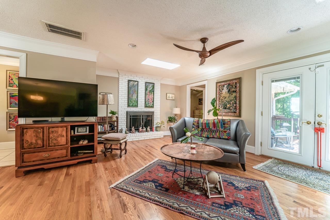 3318 Hampton Road Raleigh, NC 27607 - Photo 9 of 56 a living room with furniture and a flat screen tv