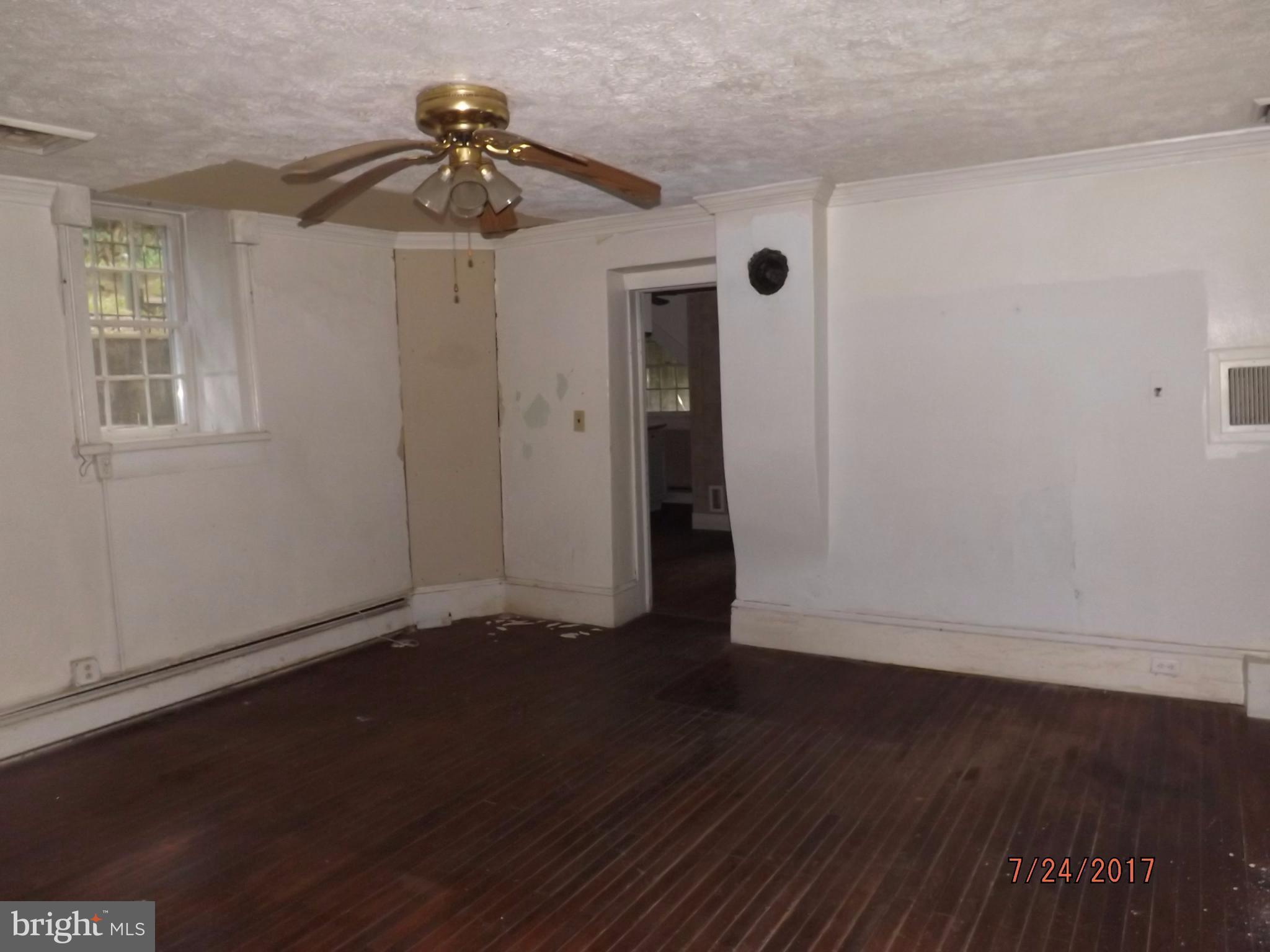 10 Big Spring Street Luray, VA 22835 - Photo 12 of 14 a view of an empty room with a window and wooden floor