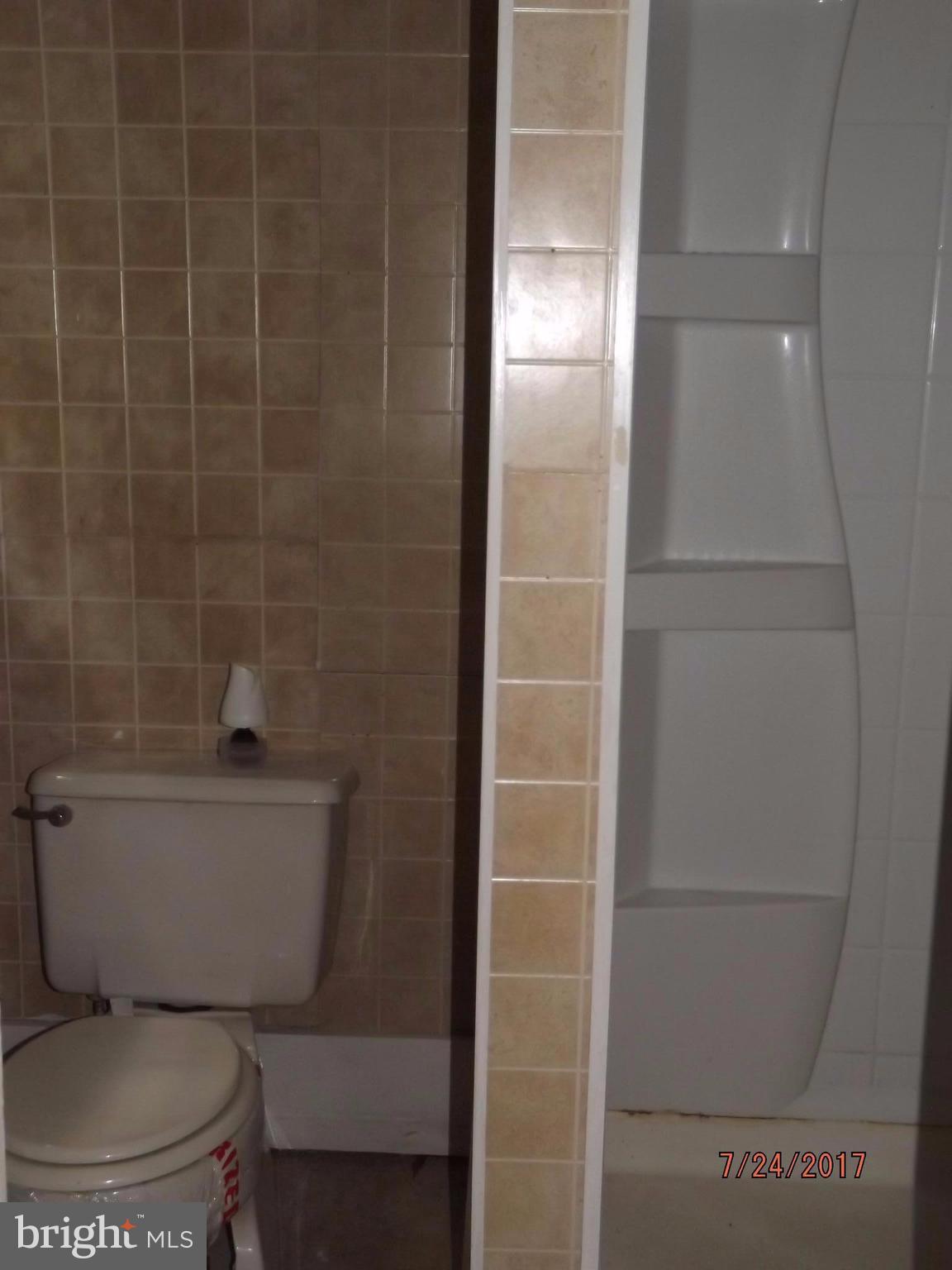 10 Big Spring Street Luray, VA 22835 - Photo 14 of 14 a bathroom with a toilet and a shower