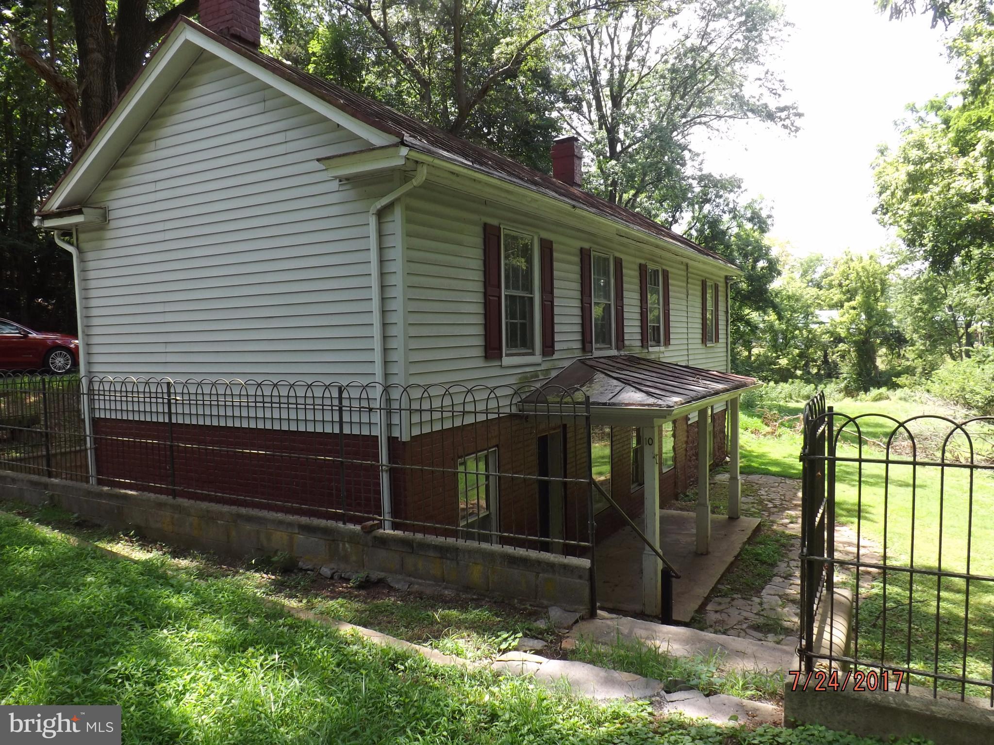 10 Big Spring Street Luray, VA 22835 - Photo 3 of 14 a view of a house with backyard and sitting area