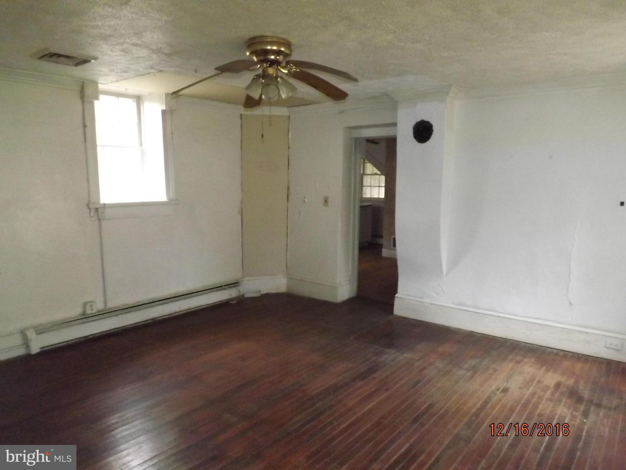 10 Big Spring Street Luray, VA 22835 - Photo 6 of 14 wooden floor in an empty room with a window