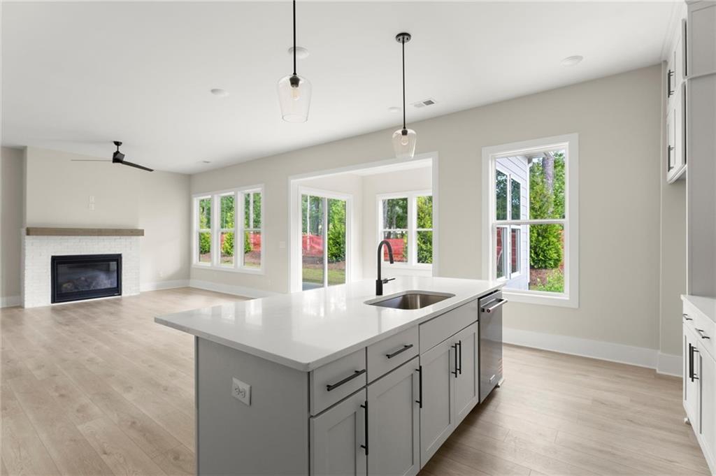 3552 Cedarvale Court Powder Springs, GA 30127 - Photo 12 of 46 a kitchen with stainless steel appliances granite countertop a sink and a window