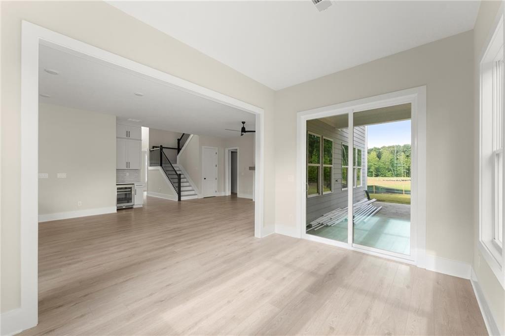 3552 Cedarvale Court Powder Springs, GA 30127 - Photo 18 of 46 a view of empty room with wooden floor and fan