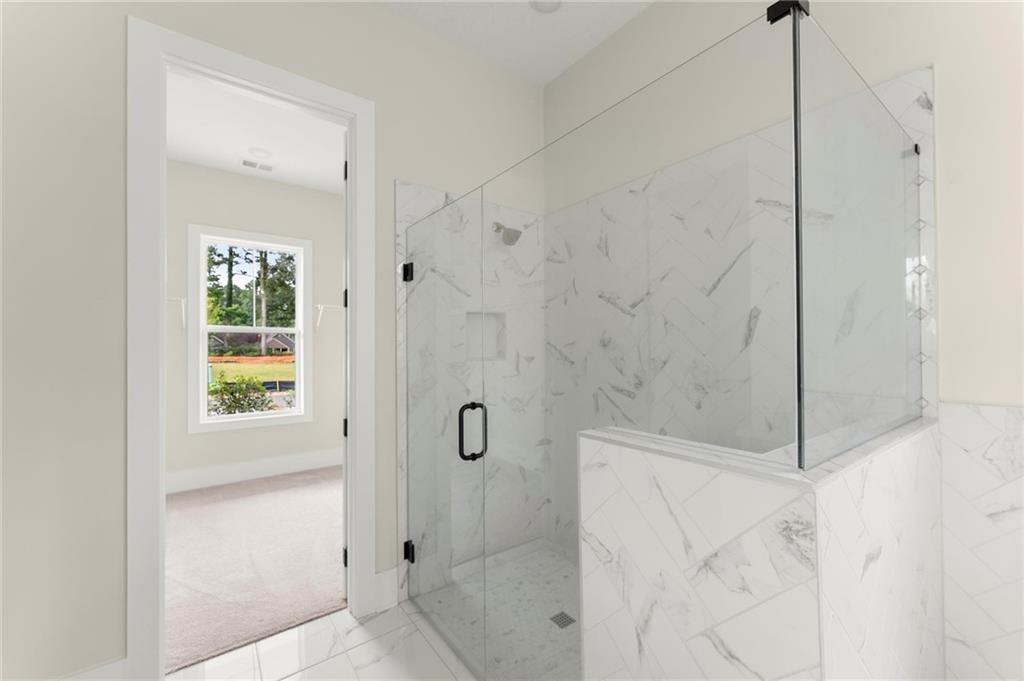 3552 Cedarvale Court Powder Springs, GA 30127 - Photo 26 of 46 a bathroom with a shower