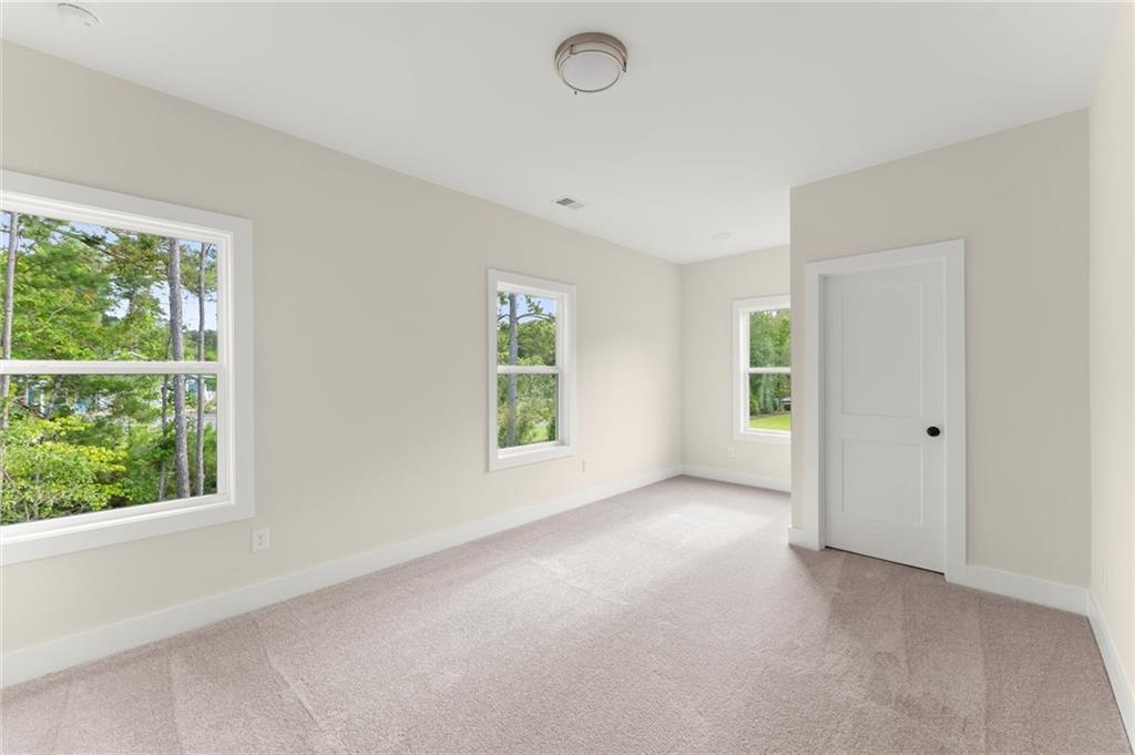 3552 Cedarvale Court Powder Springs, GA 30127 - Photo 33 of 46 an empty room with windows and closet
