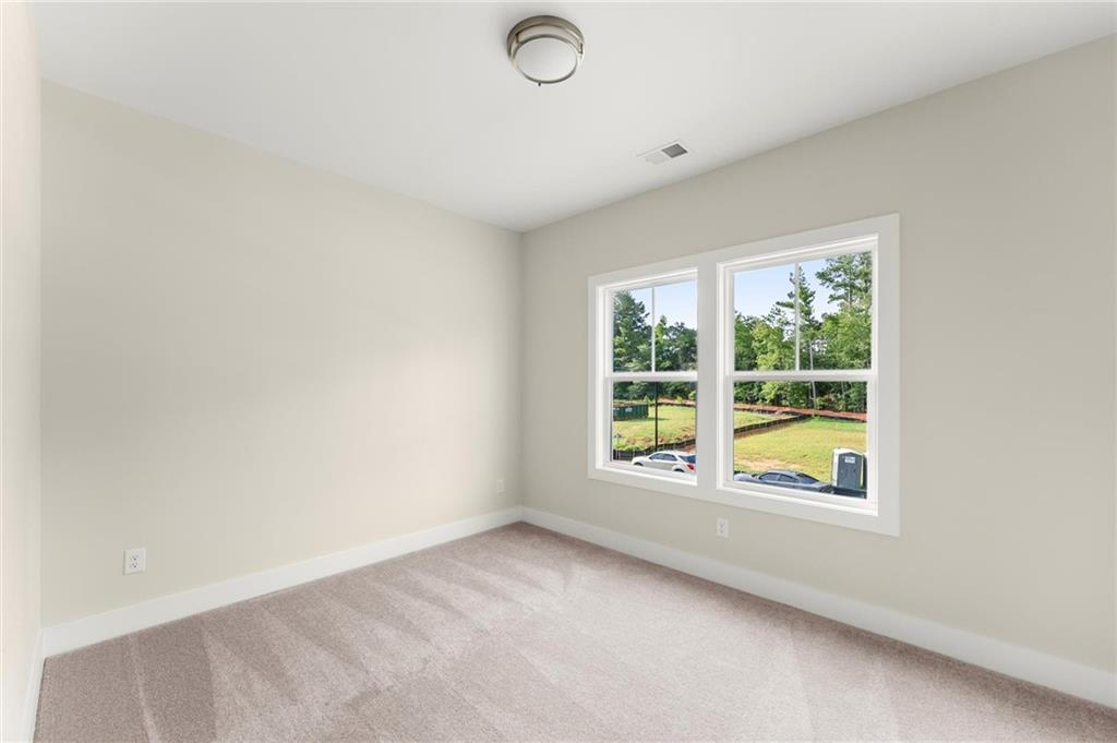 3552 Cedarvale Court Powder Springs, GA 30127 - Photo 39 of 46 an empty room with a window