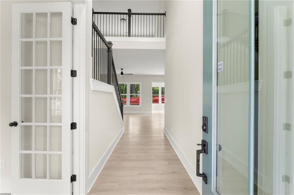 3552 Cedarvale Court Powder Springs, GA 30127 - Photo 4 of 46 a view of a hallway with wooden floor and entryway