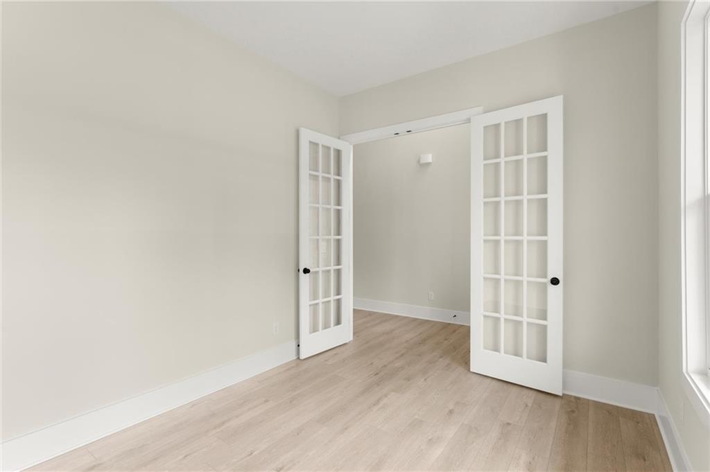 3552 Cedarvale Court Powder Springs, GA 30127 - Photo 6 of 46 an empty room with wooden floor and windows