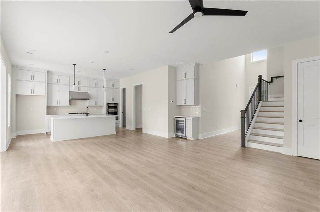 3552 Cedarvale Court Powder Springs, GA 30127 - Photo 10 of 46 a view of a kitchen with wooden floor and electronic appliances