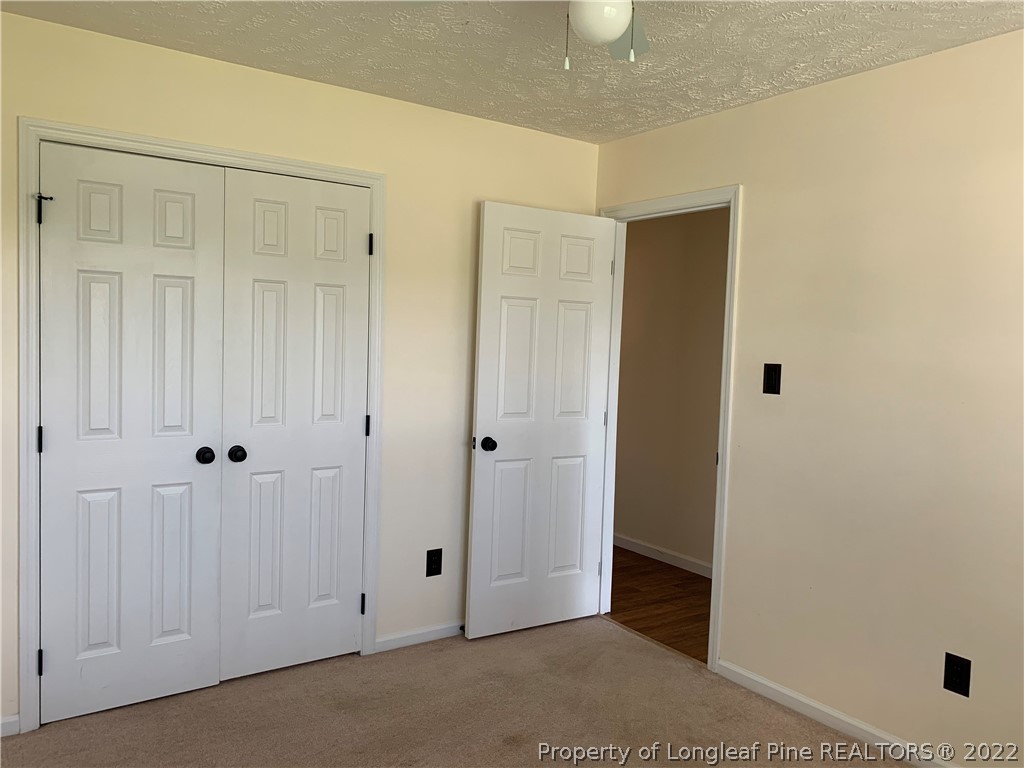 145 Rye Lane Raeford, NC 28376 - Photo 26 of 42 a view of a hallway with closet area