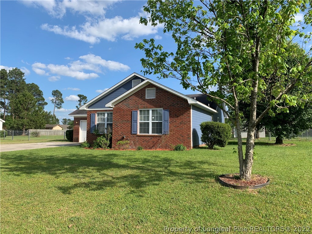 145 Rye Lane Raeford, NC 28376 - Photo 3 of 42 a front view of house with a garden