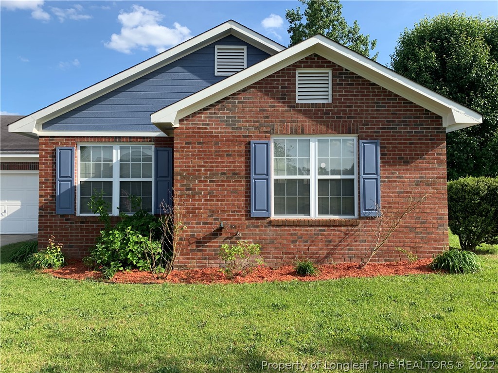 145 Rye Lane Raeford, NC 28376 - Photo 5 of 42 a front view of a house with a yard