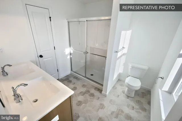 a bathroom with a sink and toilet