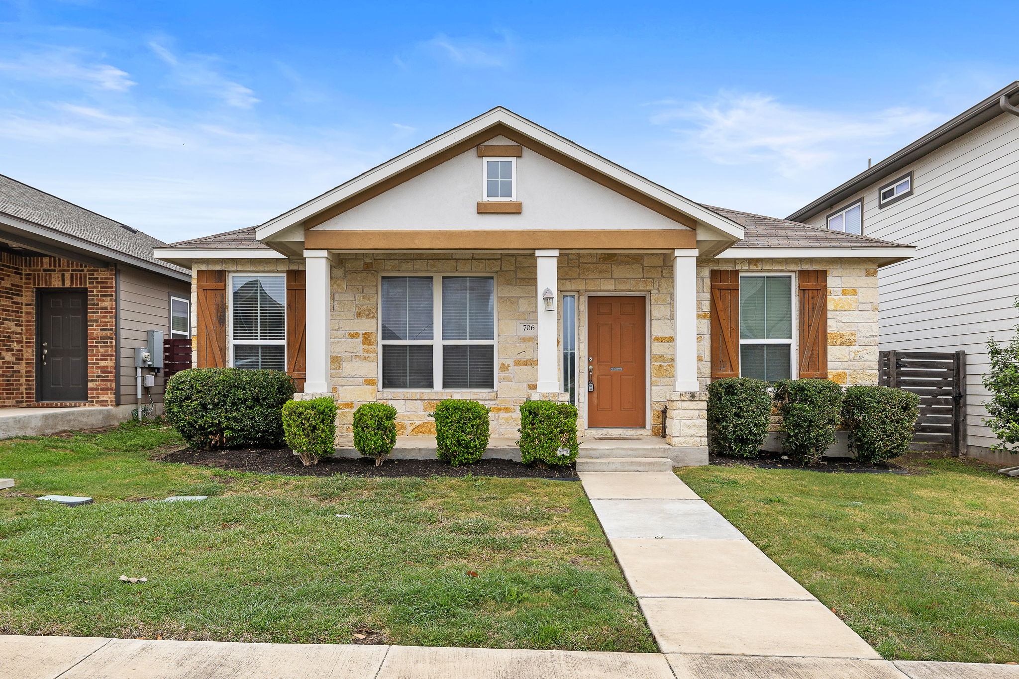 706 Coconut Grove Street Pflugerville, TX 78660 - Photo 2 of 23 Welcome home to charming curb appeal with a beautiful stone exterior, inviting front porch, and fresh landscaping that creates a warm first impression.
