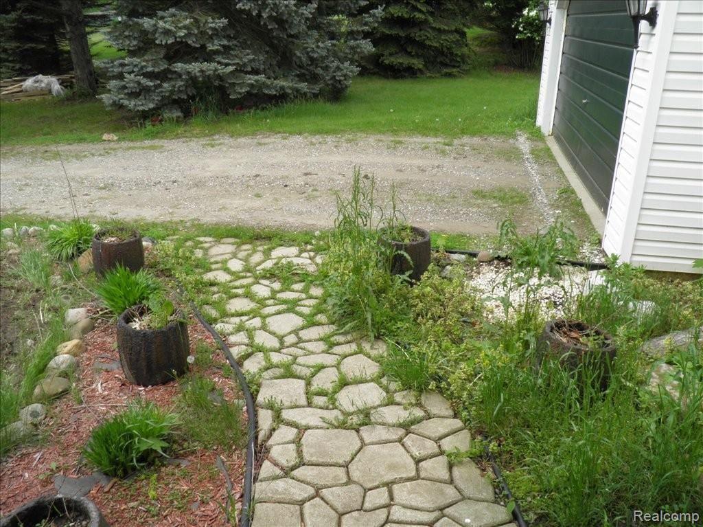 6060 Ford Road Commerce Township, MI 48382 - Photo 2 of 25 Pressed concrete walkway