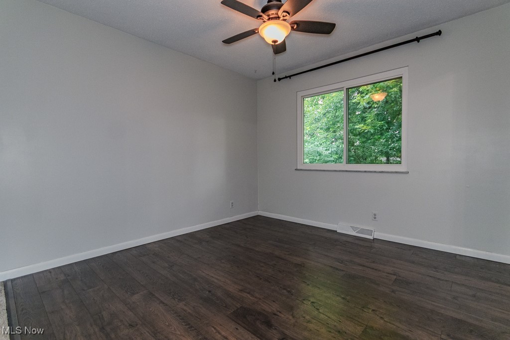 2969 Gale Road Willoughby, OH 44094 - Photo 27 of 46 Unfurnished room featuring dark wood-style floors and ceiling fan