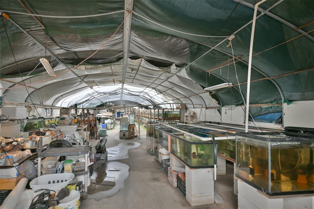 14451 Highland Road Wimauma, FL 33598 - Photo 25 of 80 a view of a storage room