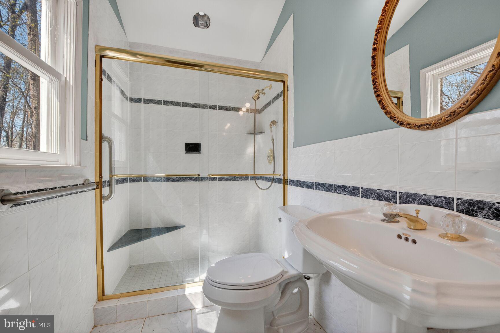 21733 Oatlands Road Aldie, VA 20105 - Photo 11 of 50 a bathroom with a sink and a mirror