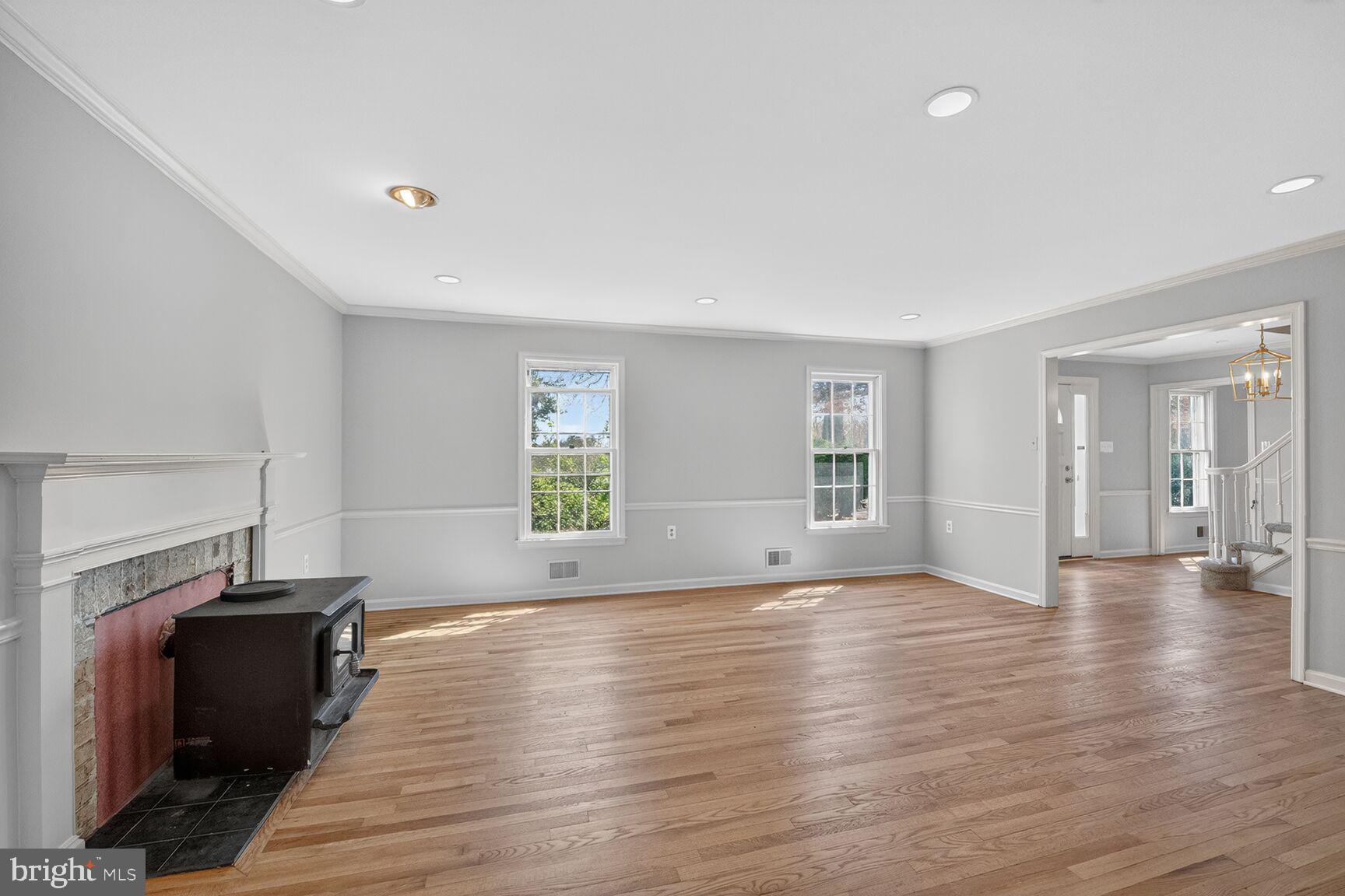 21733 Oatlands Road Aldie, VA 20105 - Photo 16 of 50 a view of an empty room with wooden floor and a window