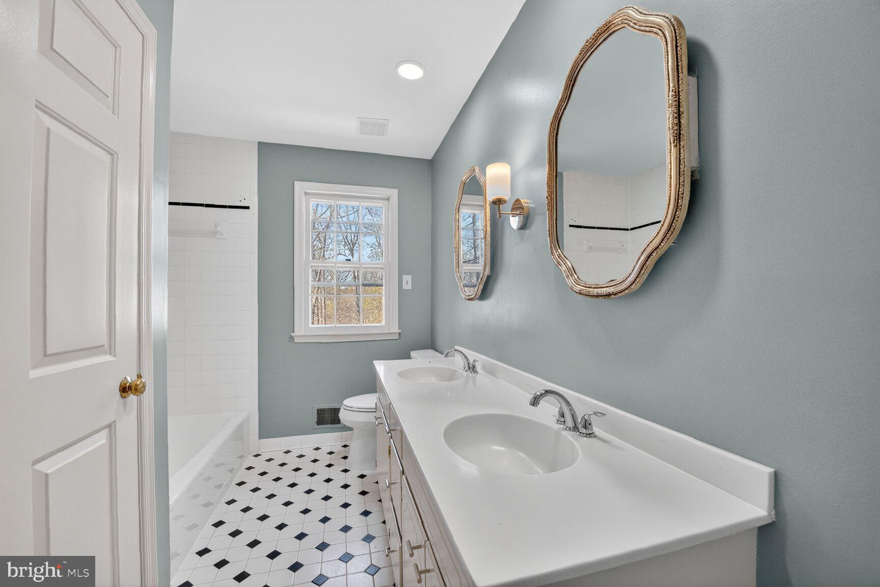 21733 Oatlands Road Aldie, VA 20105 - Photo 25 of 50 a bathroom with a sink and a mirror