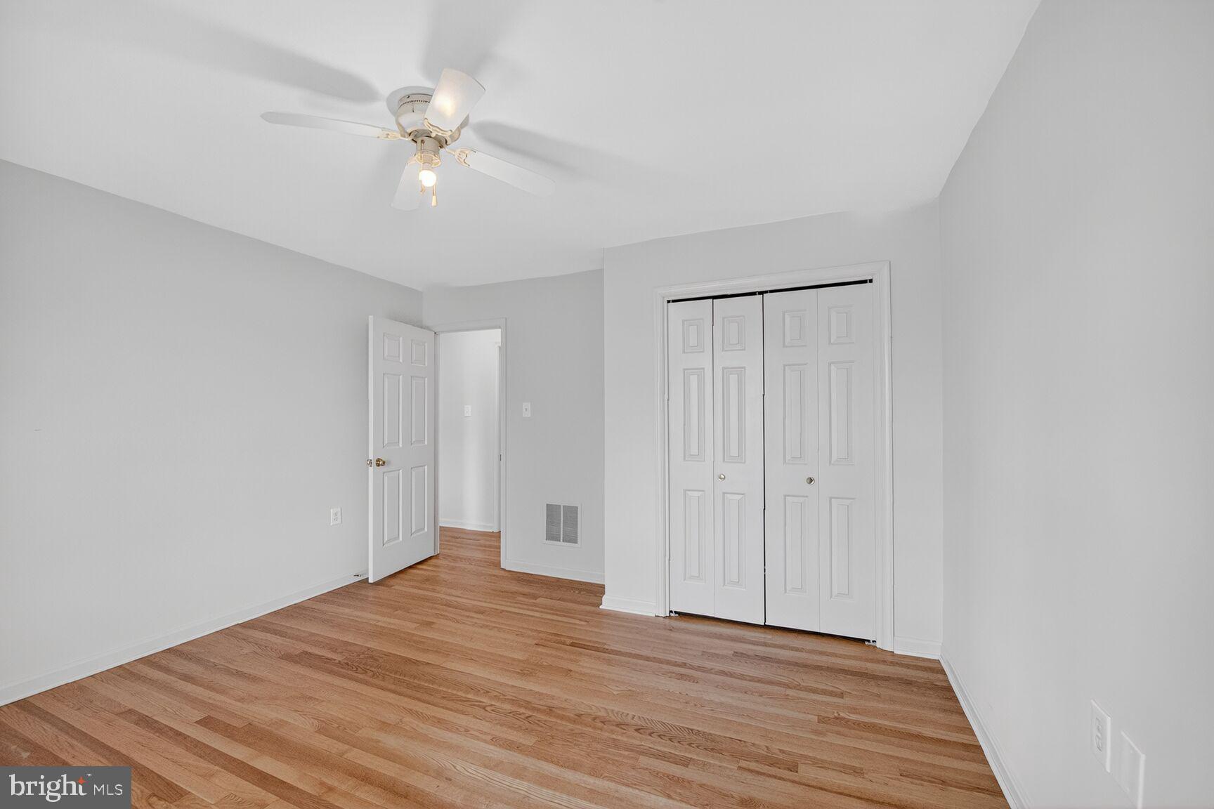 21733 Oatlands Road Aldie, VA 20105 - Photo 28 of 50 a view of a room with wooden floor and ceiling fan