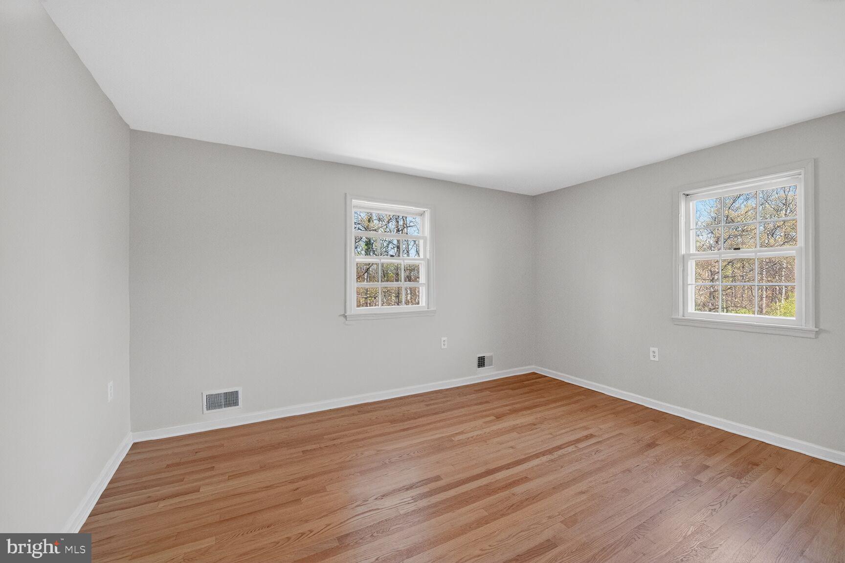 21733 Oatlands Road Aldie, VA 20105 - Photo 29 of 50 wooden floor in an empty room with a window