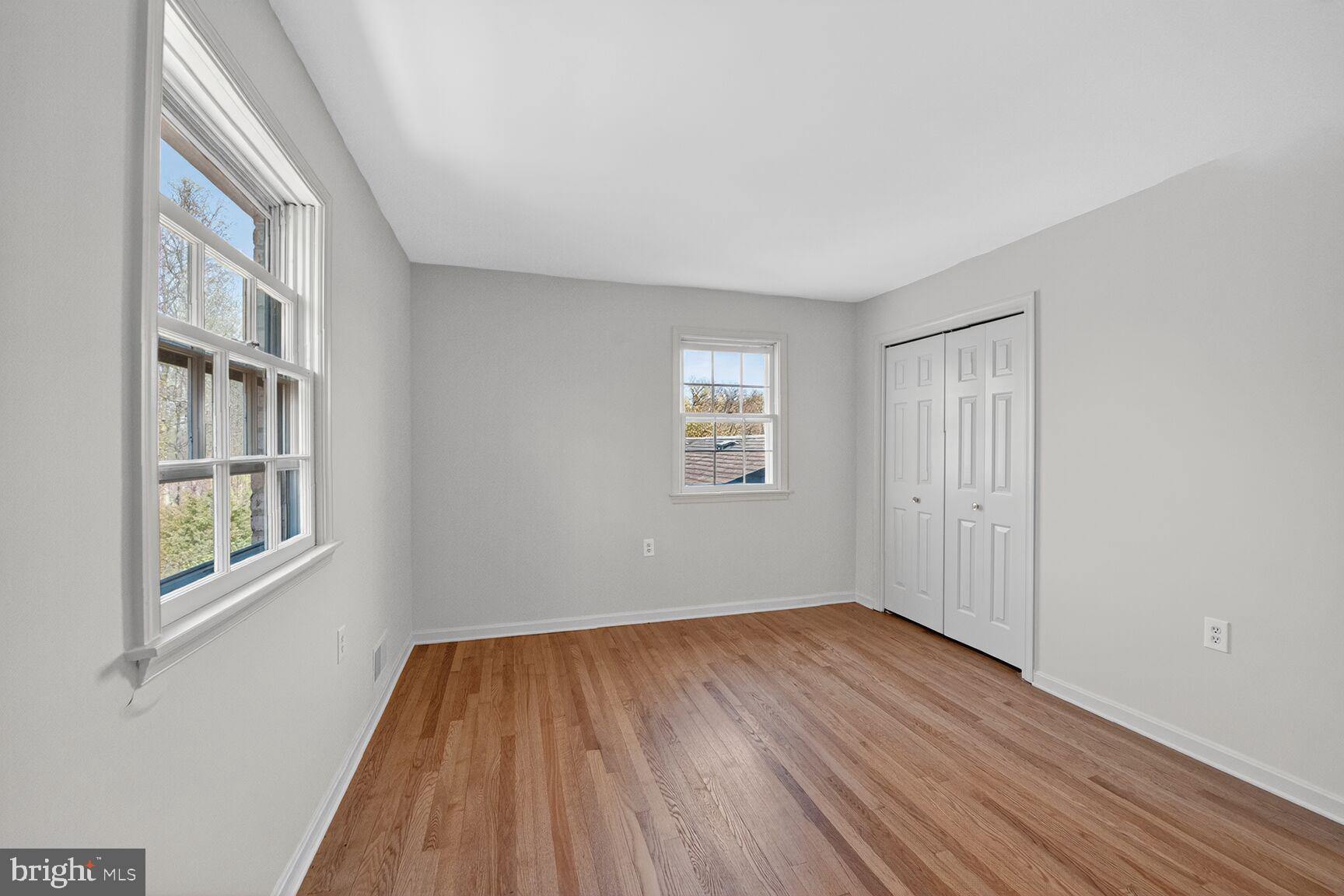 21733 Oatlands Road Aldie, VA 20105 - Photo 30 of 50 a view of an empty room with wooden floor and a window