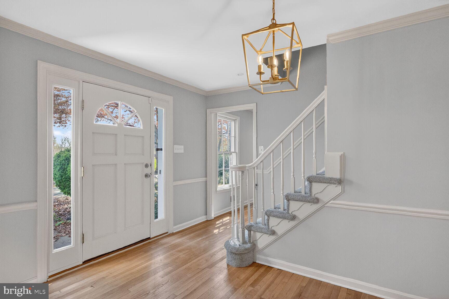 21733 Oatlands Road Aldie, VA 20105 - Photo 32 of 50 a view of entryway with stairs and wooden floor