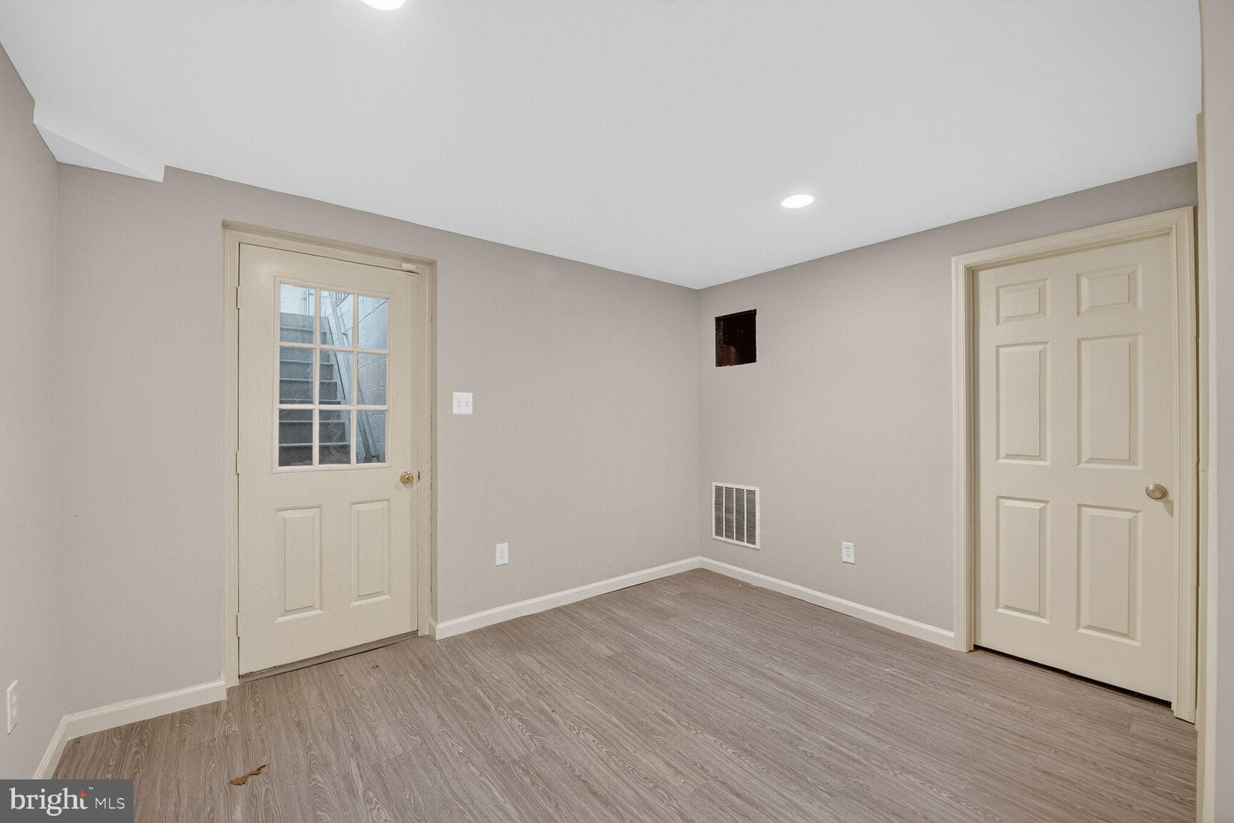 21733 Oatlands Road Aldie, VA 20105 - Photo 37 of 50 a view of an empty room with wooden floor and closet