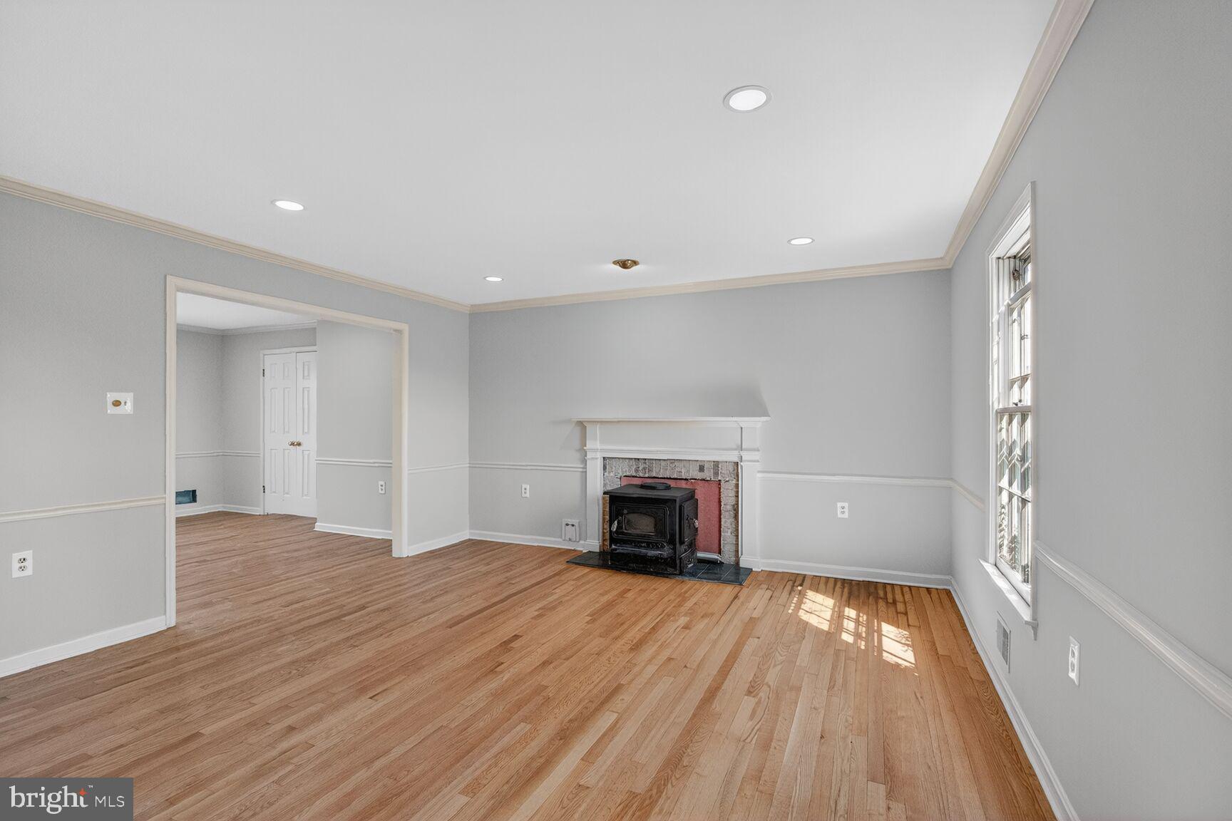 21733 Oatlands Road Aldie, VA 20105 - Photo 5 of 50 wooden floor in an empty room with a window