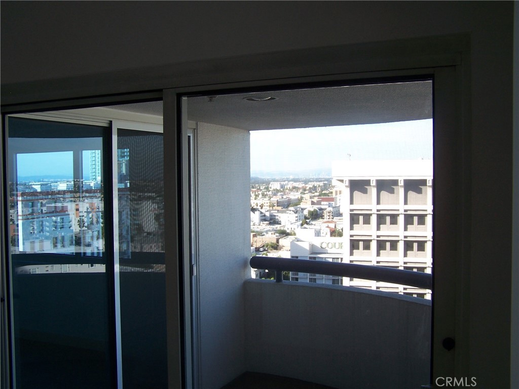 525 East Seaside Way, Unit 1601 Long Beach, CA 90802 - Photo 17 of 60 a view of a glass door with a view of balcony