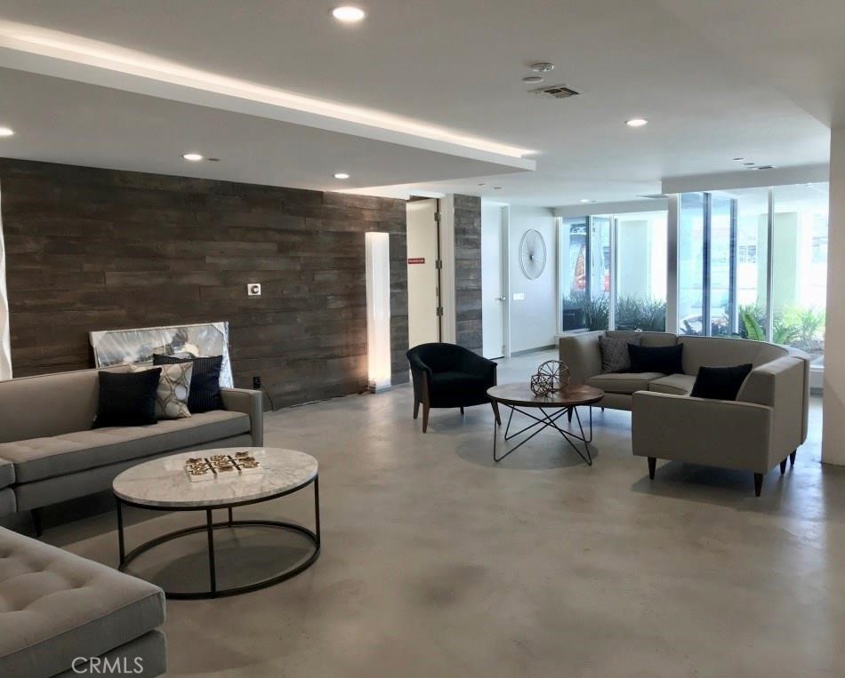 525 East Seaside Way, Unit 1601 Long Beach, CA 90802 - Photo 9 of 60 a living room with furniture and a large window