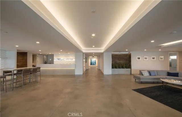 a view of a room with large windows