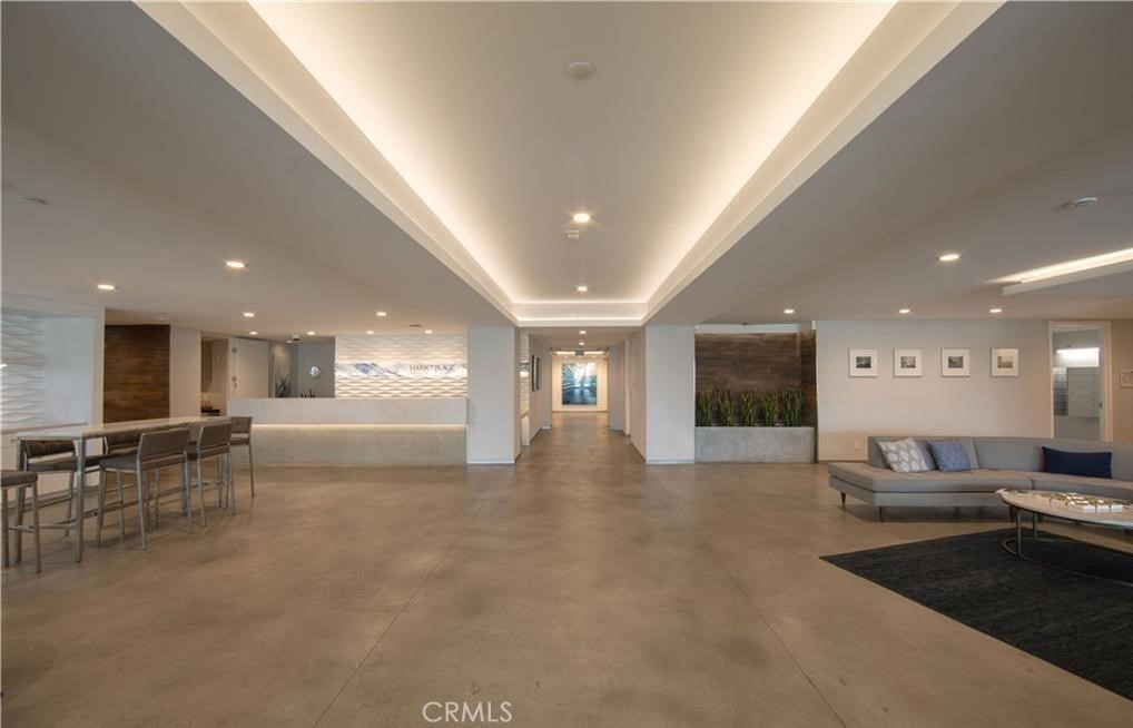 525 East Seaside Way, Unit 1601 Long Beach, CA 90802 - Photo 10 of 60 a living room with furniture and a flat screen tv