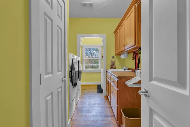 a bathroom with a shower and a sink
