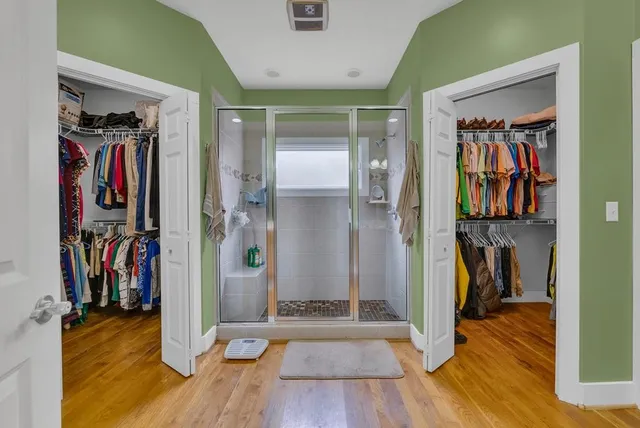 a bathroom with a shower and a toilet