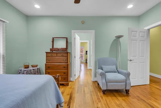 a bedroom with a bed furniture and a window