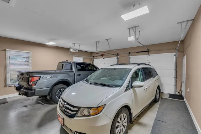 a living room with furniture pool table and a flat screen tv