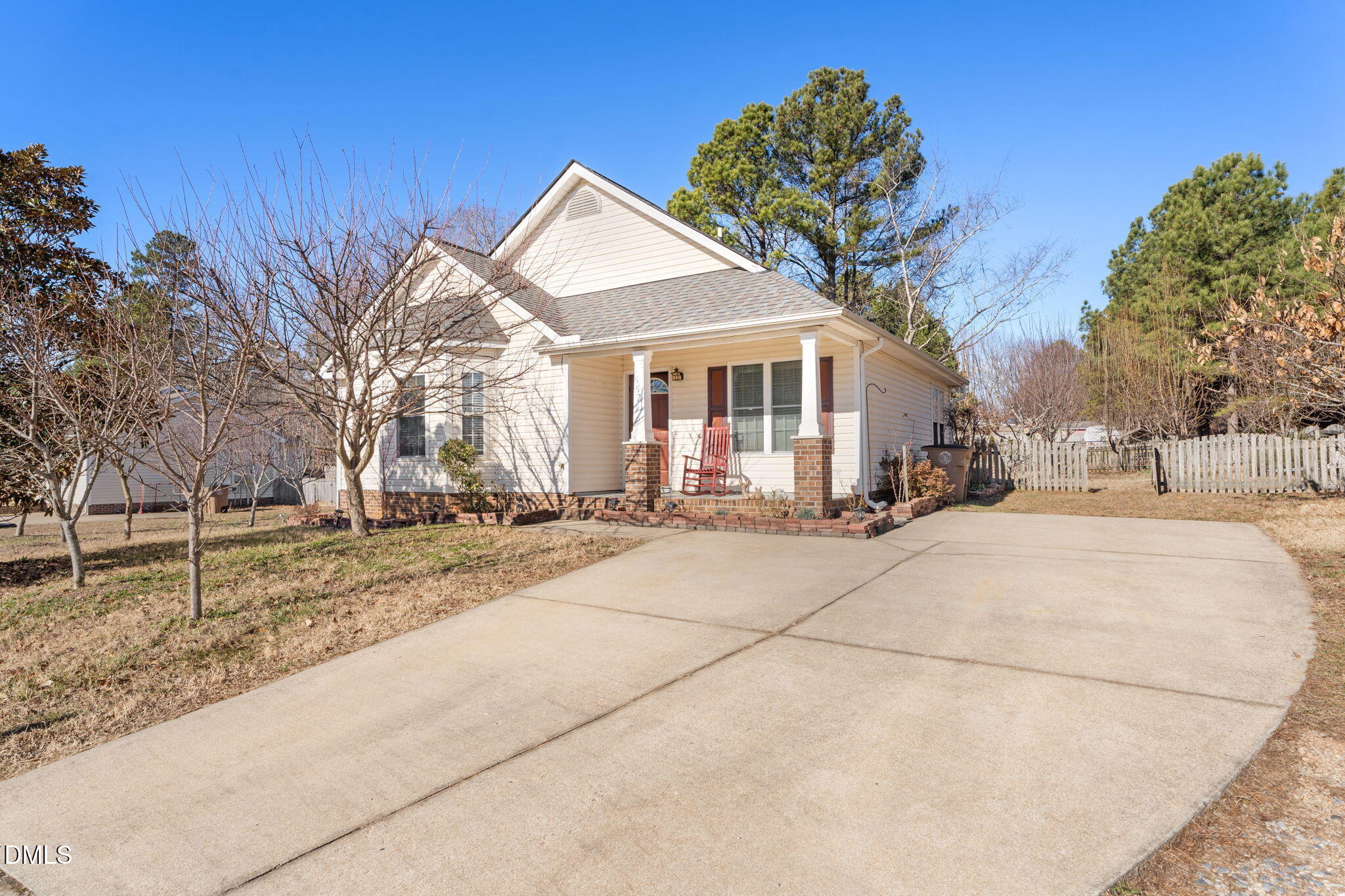 a view of a white house with a yard