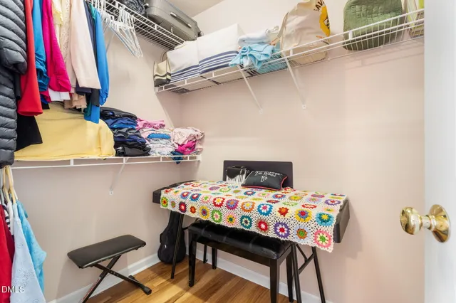 a small space with a table and a dresser