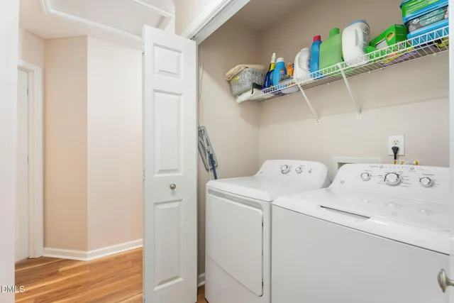 a view of storage and utility room with washer and dryer