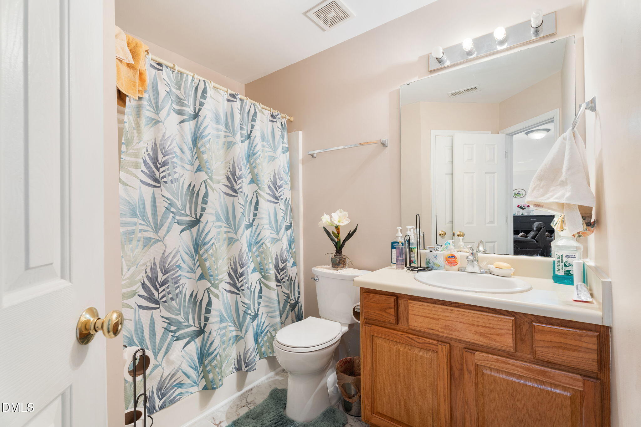 657 Flaherty Avenue Wake Forest, NC 27587 - Photo 16 of 25 a bathroom with a sink toilet and shower
