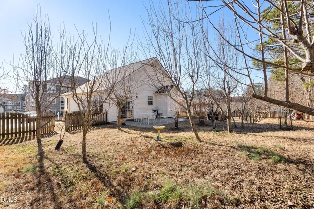 a view of yard covered with snow in front of house