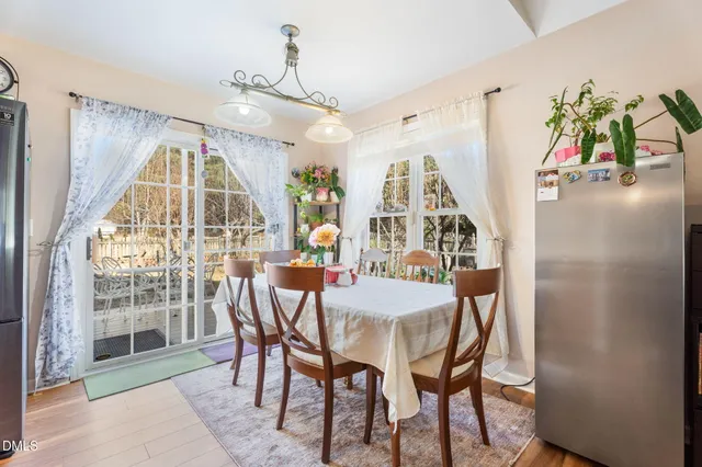 a view of a dining room with furniture and a window