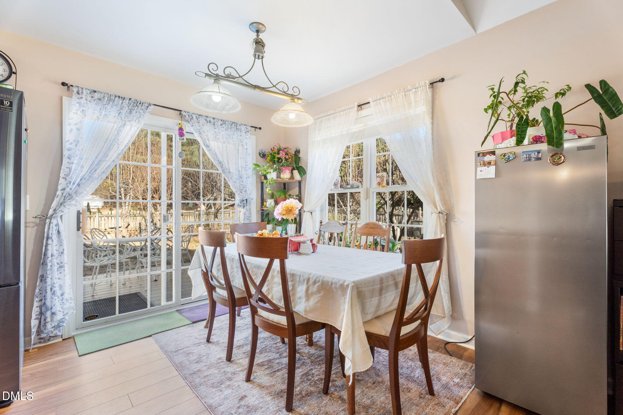 657 Flaherty Avenue Wake Forest, NC 27587 - Photo 7 of 25 a view of a dining room with furniture and a window