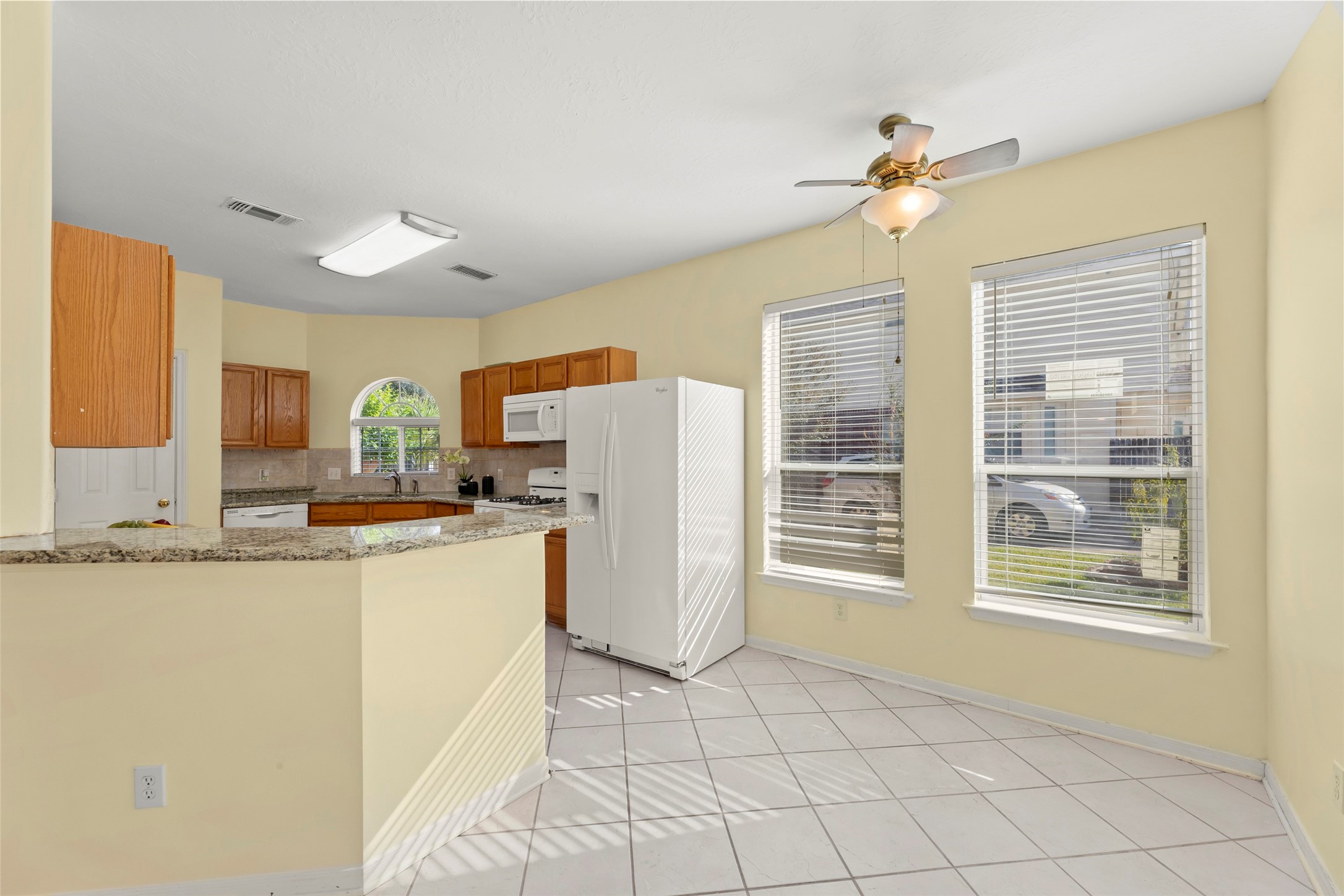 14715 Rancho Vista Drive Houston, TX 77083 - Photo 12 of 38 a kitchen with refrigerator and cabinets